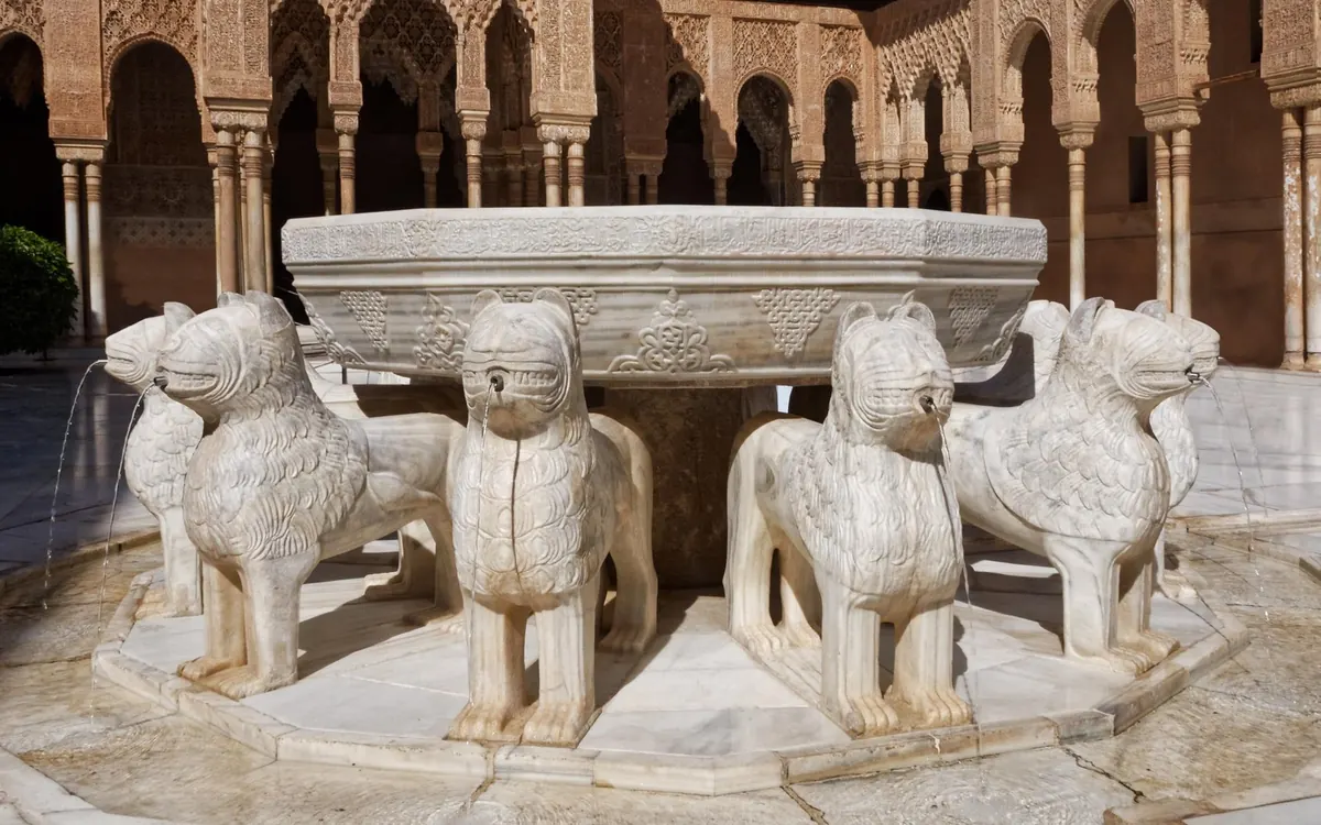 The Court of the Lions with its marble fountain in the Nasrid Palaces, Alhambra
