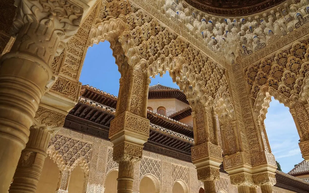 A hall in the Nasrid Palaces of the Alhambra with carved stucco walls